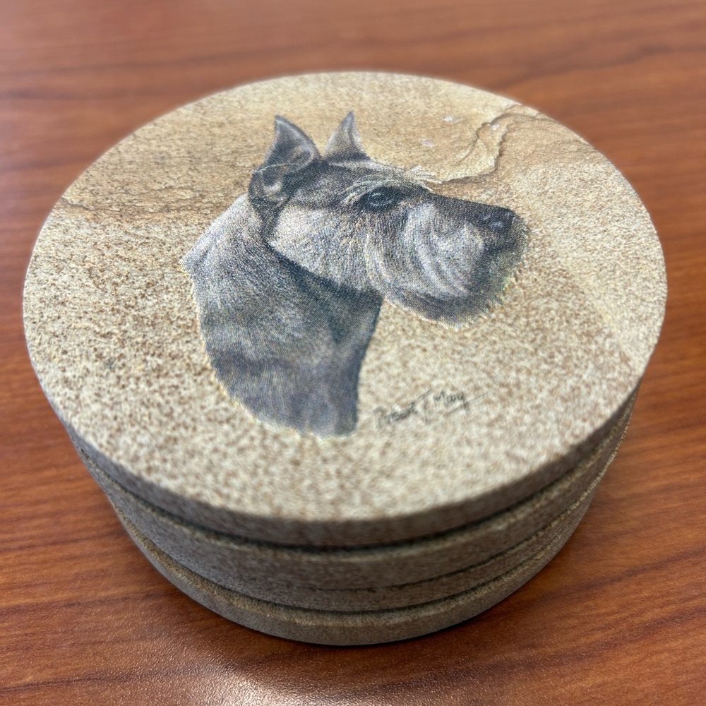 Schnauzer Dog Soapstone Coasters (4)
Robert J. May Artist. No chips or stains.